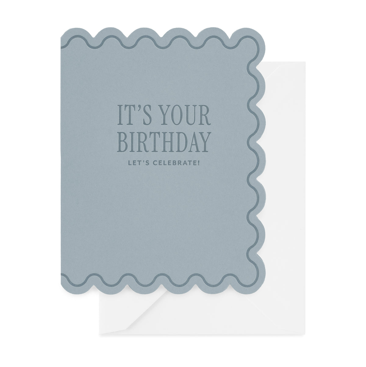 A blue birthday card with scalloped edges printed with 'it's your birthday let's celebrate' in blue text paired with a white envelope
