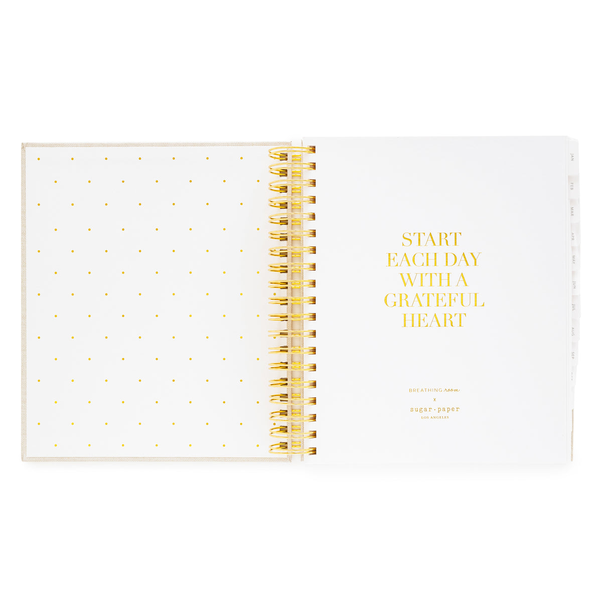Daily spiral planner with gold spiral binding and 'Start Each Day With A Grateful Heart' in gold foil