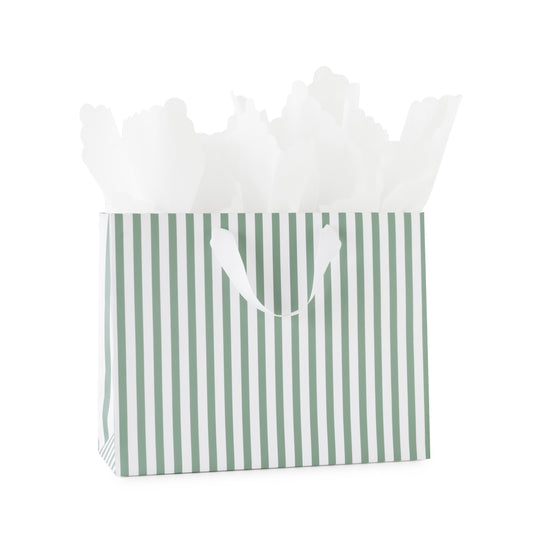 A green and white striped gift bag with white tissue paper and white ribbon handles