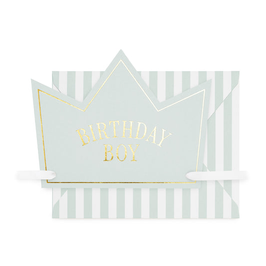 Blue paper crown card printed with 'birthday boy' in gold foil with white grosgrain ribbon paired with a blue and white striped envelope
