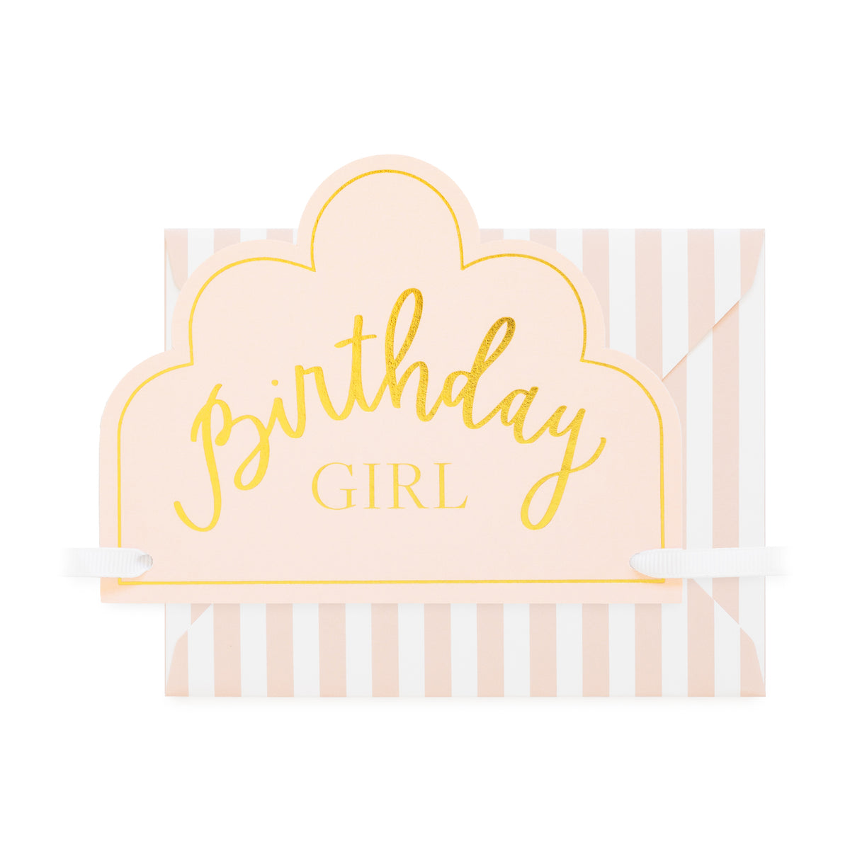 A pastel pink and white striped envelope with a crown diecut card front panel outlined in gold, featuring the words 'birthday GIRL' in gold script and block lettering with white ribbon ties to tie to head