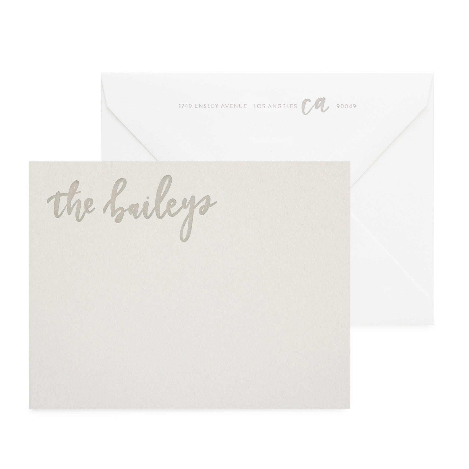 Grey notepad letterpress printed in warm grey ink with white envelope
