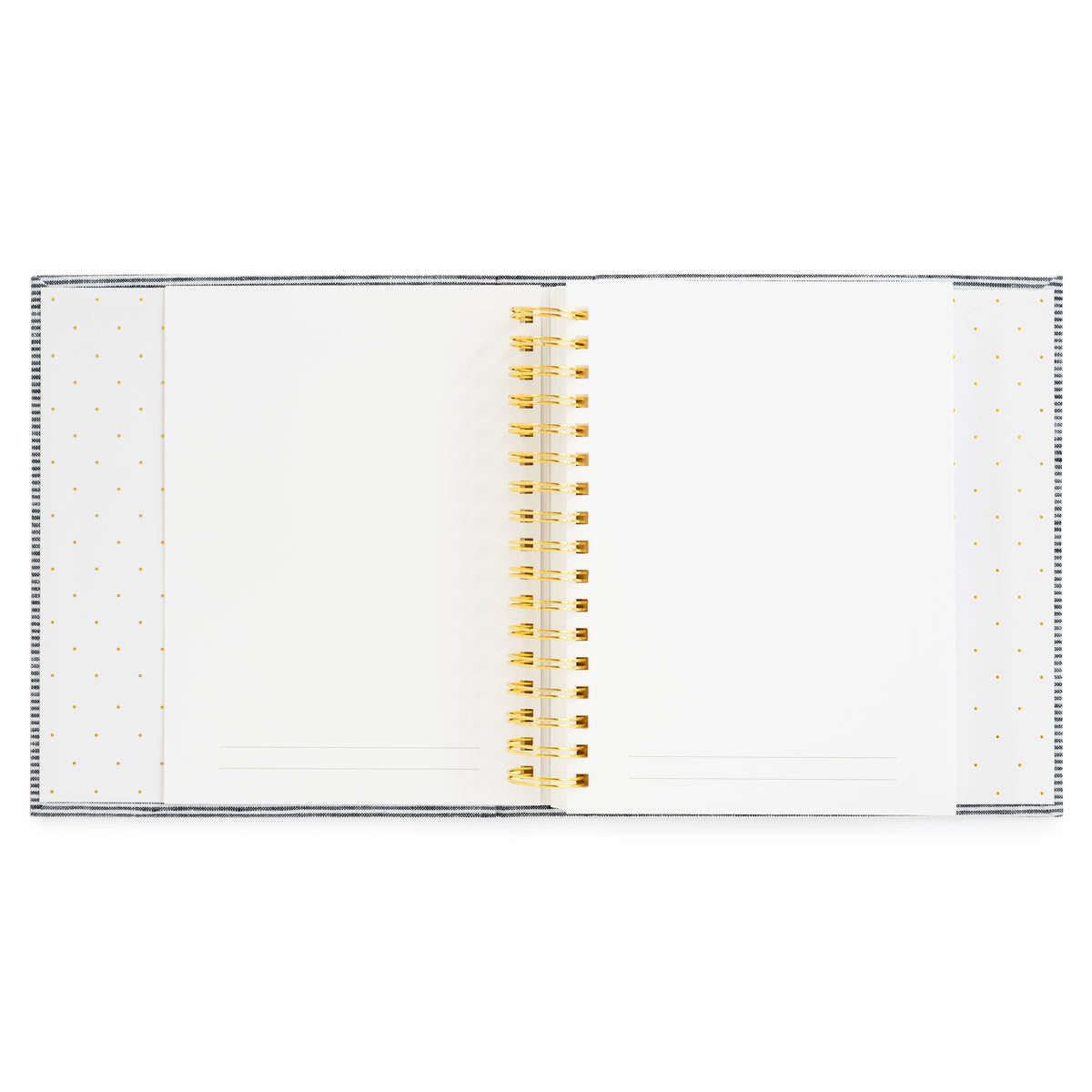 A white spiral-bound interior of the Halloween Book with a gold wire coil binding and delicate gold polka dot patterns on the left and right covers with white pages with gold lines at the bottom for prompts