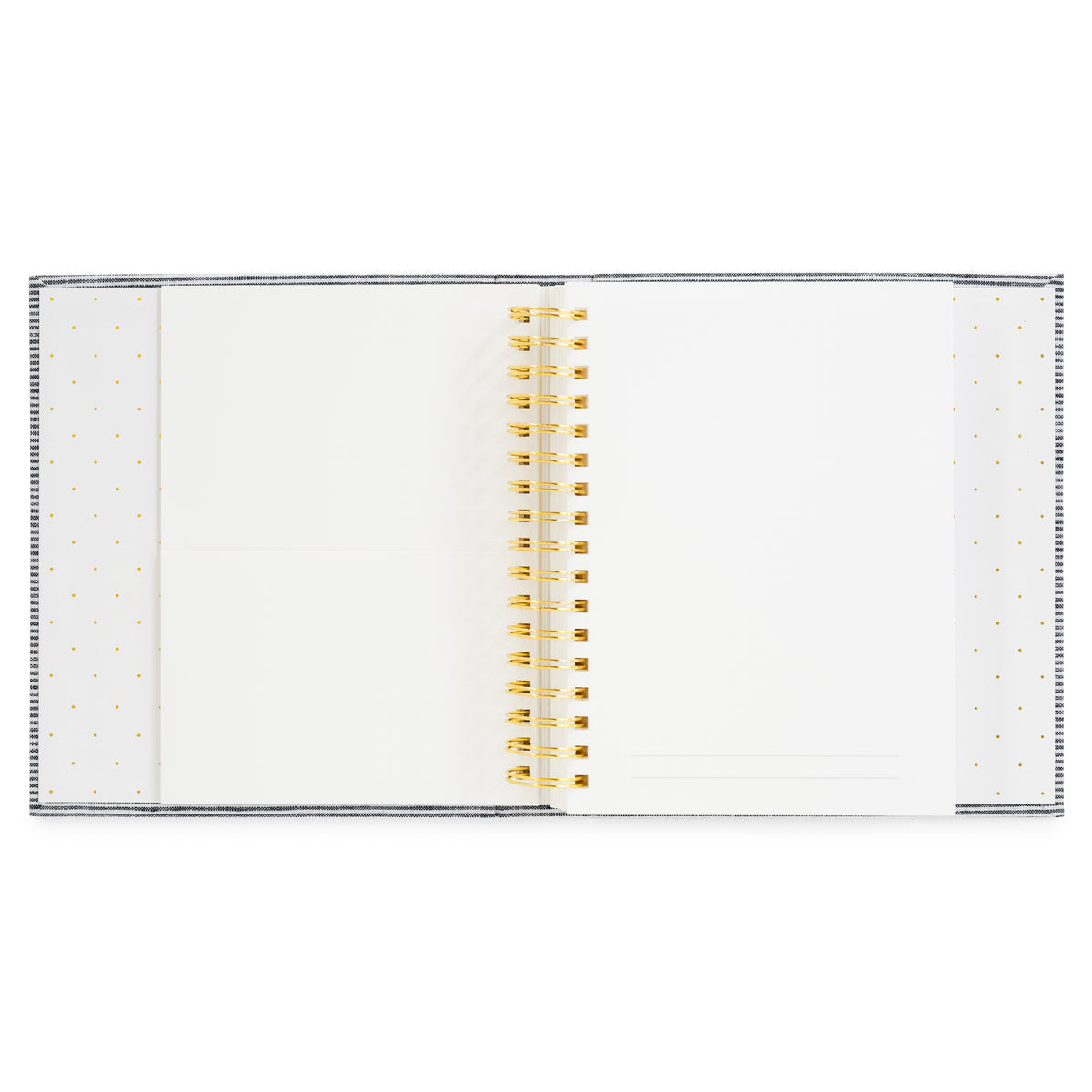 Interior of the halloween book featuring white pages with a gold wire coil binding and gold polka dots on the interior binding featuring pockets for keespakes