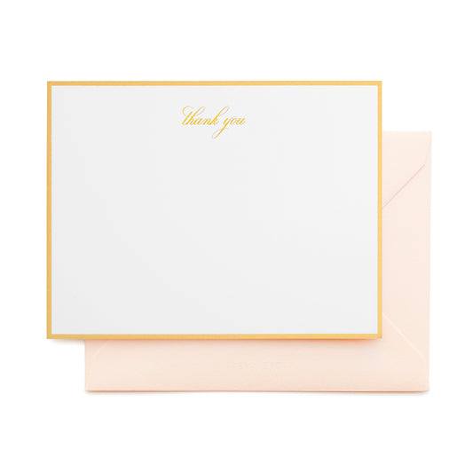white card with gold thank you text and gold border, pale pink envelope