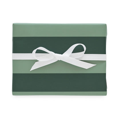 Mint and dark green wrapping paper wrapped on a gift with a white ribbon